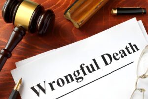 Lawyer discussing a wrongful death case with a client in an office, emphasizing legal advice and support.